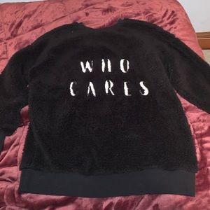 “WHO CARES” fuzzy crew neck sweater